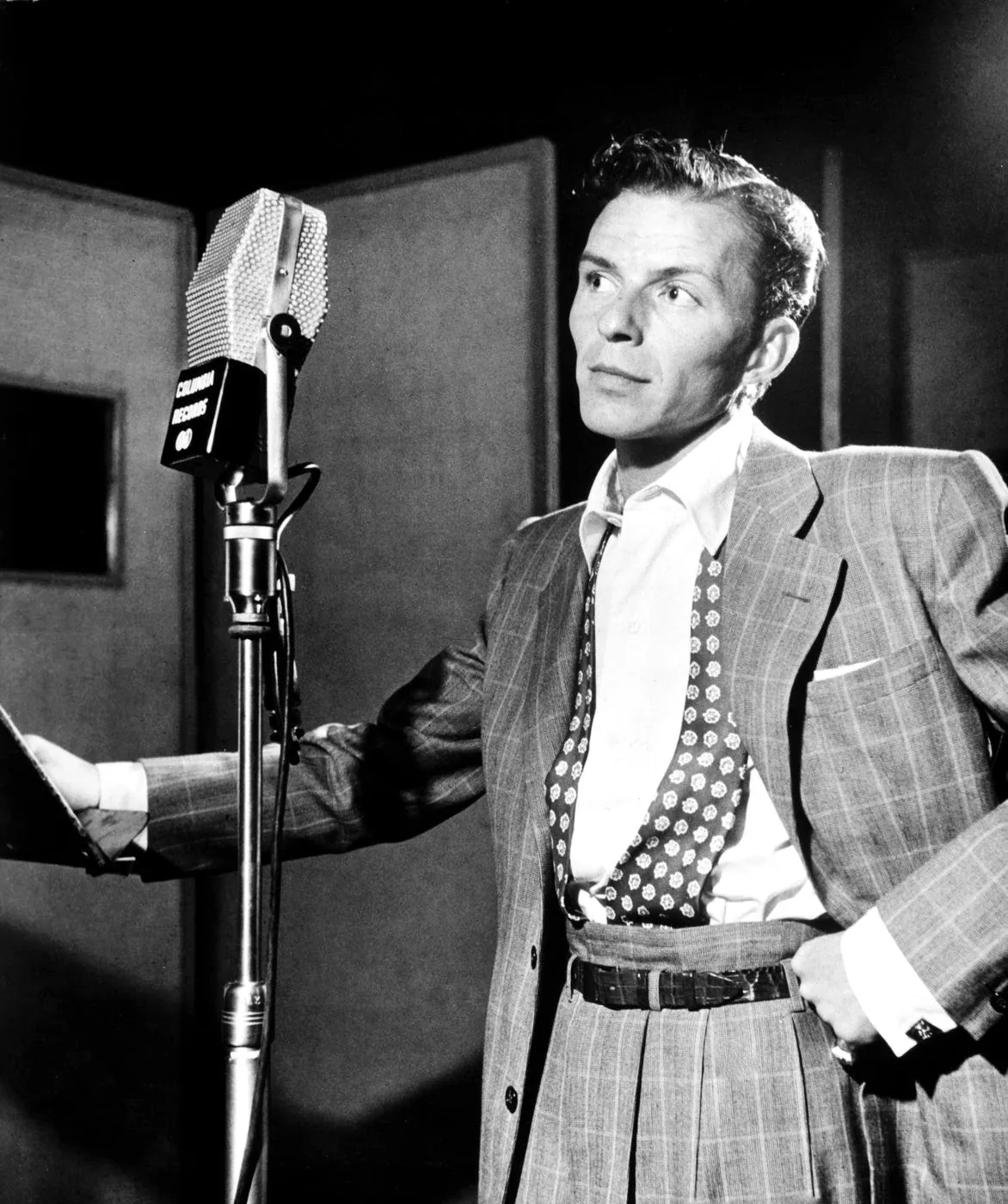 Frank Sinatra singing at a Columbia Records studio microphone, circa 1947
