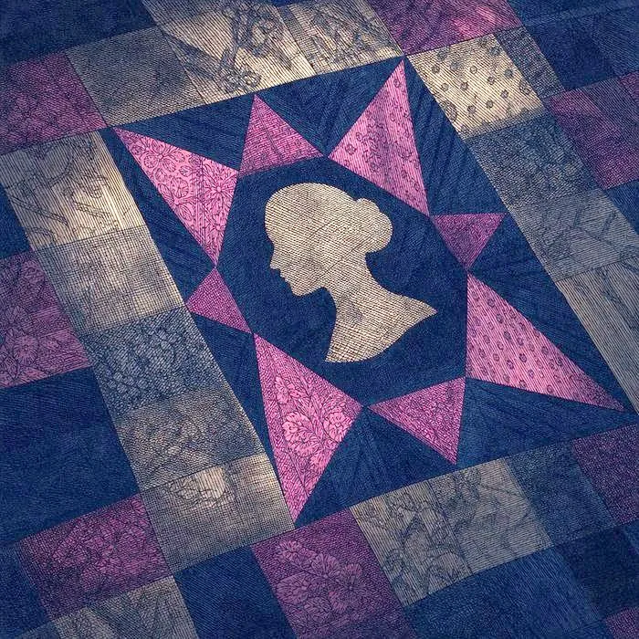 An antique handmade quilt pattern detail